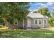 Charming single-story home with gray siding, well-maintained lawn, and inviting front entrance at 1103 Oklahoma St, Kannapolis, NC 28083