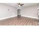 Bright living room features hardwood floors and neutral paint, along with arched doorway at 1103 Oklahoma St, Kannapolis, NC 28083