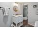 Bathroom featuring a round mirror, drawers, and a white counter at 1135 Brook Path Trl, Denver, NC 28037