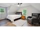 Bright bedroom featuring vaulted ceilings, ceiling fan, and cozy seating area at 1135 Brook Path Trl, Denver, NC 28037