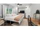 Bedroom with natural light, hardwood floors, walk-in closet, and neutral decor at 1135 Brook Path Trl, Denver, NC 28037