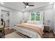 Cozy bedroom with neutral colors, a ceiling fan and large windows for natural light at 1135 Brook Path Trl, Denver, NC 28037