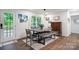 Cozy dining area with modern table and chairs, bright natural light, and a view to the outdoors at 1135 Brook Path Trl, Denver, NC 28037