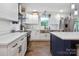 Modern kitchen with white cabinets, stainless steel appliances, and lots of counter space at 1135 Brook Path Trl, Denver, NC 28037