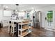 Modern kitchen with stainless steel appliances, center island, and white cabinetry at 1135 Brook Path Trl, Denver, NC 28037
