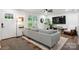 Comfortable living room featuring modern decor, hardwood floors, and lots of natural light at 1135 Brook Path Trl, Denver, NC 28037