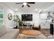 Open-concept living area featuring a cozy sitting area that flows into the eat-in kitchen at 1135 Brook Path Trl, Denver, NC 28037