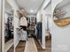 Spacious walk-in closet with custom shelving and ample storage space at 1135 Brook Path Trl, Denver, NC 28037
