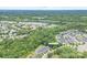 Aerial view of homes at 11945 Red Rust Lane, nestled among lush trees, offering privacy and a serene setting at 11945 Red Rust Ln, Charlotte, NC 28277