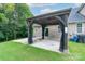 Backyard patio with curtains, a sliding door, and house view, perfect for indoor-outdoor living and entertaining at 11945 Red Rust Ln, Charlotte, NC 28277