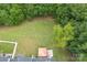 This aerial shot showcases the backyard and adjacent treeline at 11945 Red Rust Ln, Charlotte, NC 28277