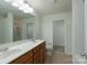 Bathroom featuring a double sink vanity and a walk-in shower at 11945 Red Rust Ln, Charlotte, NC 28277
