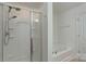 Bathroom showcasing a glass-enclosed shower and soaking tub at 11945 Red Rust Ln, Charlotte, NC 28277