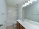Bathroom featuring a vanity, mirror, and tub/shower combo at 11945 Red Rust Ln, Charlotte, NC 28277