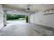 View of an empty garage with an open door and concrete floor at 11945 Red Rust Ln, Charlotte, NC 28277