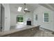 Bright living room with vaulted ceiling, skylights, and sliding glass door to patio at 11945 Red Rust Ln, Charlotte, NC 28277