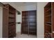 Walk-in closet featuring custom shelving and storage at 11945 Red Rust Ln, Charlotte, NC 28277