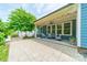 Relaxing covered back patio area with an outdoor seating arrangement, and a backyard view at 12107 Grey Partridge Dr, Charlotte, NC 28278