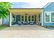 Inviting covered back patio with a seating area, string lights, and a view of the backyard at 12107 Grey Partridge Dr, Charlotte, NC 28278