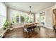 Dining area with wooden table, bench, and natural light at 12107 Grey Partridge Dr, Charlotte, NC 28278