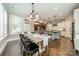 Dining room with an adjoining view to the kitchen and living room, plus lots of natural light at 12107 Grey Partridge Dr, Charlotte, NC 28278