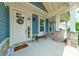 Inviting front porch featuring stone accents, decorative wreath, and a cozy seating area at 12107 Grey Partridge Dr, Charlotte, NC 28278