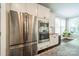 Stainless steel refrigerator, oven, and microwave in a bright modern kitchen at 12107 Grey Partridge Dr, Charlotte, NC 28278