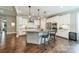 Modern kitchen with white cabinets, granite countertops, and stainless steel appliances at 12107 Grey Partridge Dr, Charlotte, NC 28278