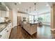 Bright kitchen with granite countertops, stainless steel appliances, and a farmhouse sink at 12107 Grey Partridge Dr, Charlotte, NC 28278