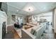 Spacious living room with coffered ceiling, a fireplace, and an open layout to the kitchen at 12107 Grey Partridge Dr, Charlotte, NC 28278