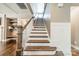 Staircase with wood treads and white risers leading to the upper level at 12107 Grey Partridge Dr, Charlotte, NC 28278