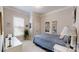Cozy bedroom with neutral walls, bright window, and blue bedding for a relaxing retreat at 123 Hanks Bluff Dr, Mooresville, NC 28117