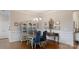 Formal dining room featuring hardwood floors, elegant lighting, and stylish decor at 123 Hanks Bluff Dr, Mooresville, NC 28117