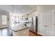 Bright kitchen featuring stainless steel appliances, granite countertops, and a spacious island at 123 Hanks Bluff Dr, Mooresville, NC 28117