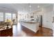 Spacious kitchen featuring stainless steel appliances, large island, and natural light at 123 Hanks Bluff Dr, Mooresville, NC 28117