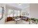 Comfortable living room with large windows, floral seating, and ample natural light at 123 Hanks Bluff Dr, Mooresville, NC 28117