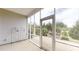 Inviting screened porch offering serene views of the landscaped backyard and mature trees at 123 Hanks Bluff Dr, Mooresville, NC 28117
