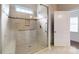 Modern shower with glass door, tiled walls, and convenient grab bar at 123 Hanks Bluff Dr, Mooresville, NC 28117