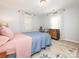 Cozy bedroom featuring a large patterned rug and a dresser near windows with sheer white curtains at 1325 Marshville Olive Branch Rd, Marshville, NC 28103