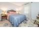 Cozy bedroom with hardwood floors, soft lighting, and a comfortable queen-size bed at 1325 Marshville Olive Branch Rd, Marshville, NC 28103