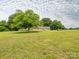 Well-maintained ranch home in a rural setting, surrounded by a large, lush green lawn at 1325 Marshville Olive Branch Rd, Marshville, NC 28103
