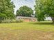 Spacious brick home with a big yard, mature trees, and ample outdoor space at 1325 Marshville Olive Branch Rd, Marshville, NC 28103