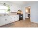 Bright kitchen with a view into the laundry room, featuring modern appliances and ample counter space at 1325 Marshville Olive Branch Rd, Marshville, NC 28103