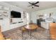 Relaxing living room featuring a TV, built-ins, and comfy seating arrangements on a patterned rug at 1325 Marshville Olive Branch Rd, Marshville, NC 28103