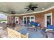 Charming covered back patio with comfortable seating, a ceiling fan, and access to the yard at 133 43Rd Avenue Nw Ln, Hickory, NC 28601