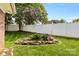 Private backyard featuring a decorative rock and stone pond with mature landscaping at 133 43Rd Avenue Nw Ln, Hickory, NC 28601