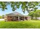Spacious brick home backyard with a covered patio and large grassy area, perfect for entertaining at 133 43Rd Avenue Nw Ln, Hickory, NC 28601