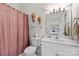 Well-lit bathroom features a white vanity, toilet, and tub with a unique shower curtain at 133 43Rd Avenue Nw Ln, Hickory, NC 28601
