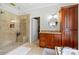 Upscale bathroom featuring a walk-in shower, granite countertops, and a separate soaking tub at 133 43Rd Avenue Nw Ln, Hickory, NC 28601