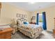 Cozy bedroom with natural light, complemented by floral bedding and blue accents at 133 43Rd Avenue Nw Ln, Hickory, NC 28601